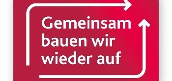 Das Foto zeigt ein Logo mit der Schrift Gemeinsam bauen wir wieder auf.